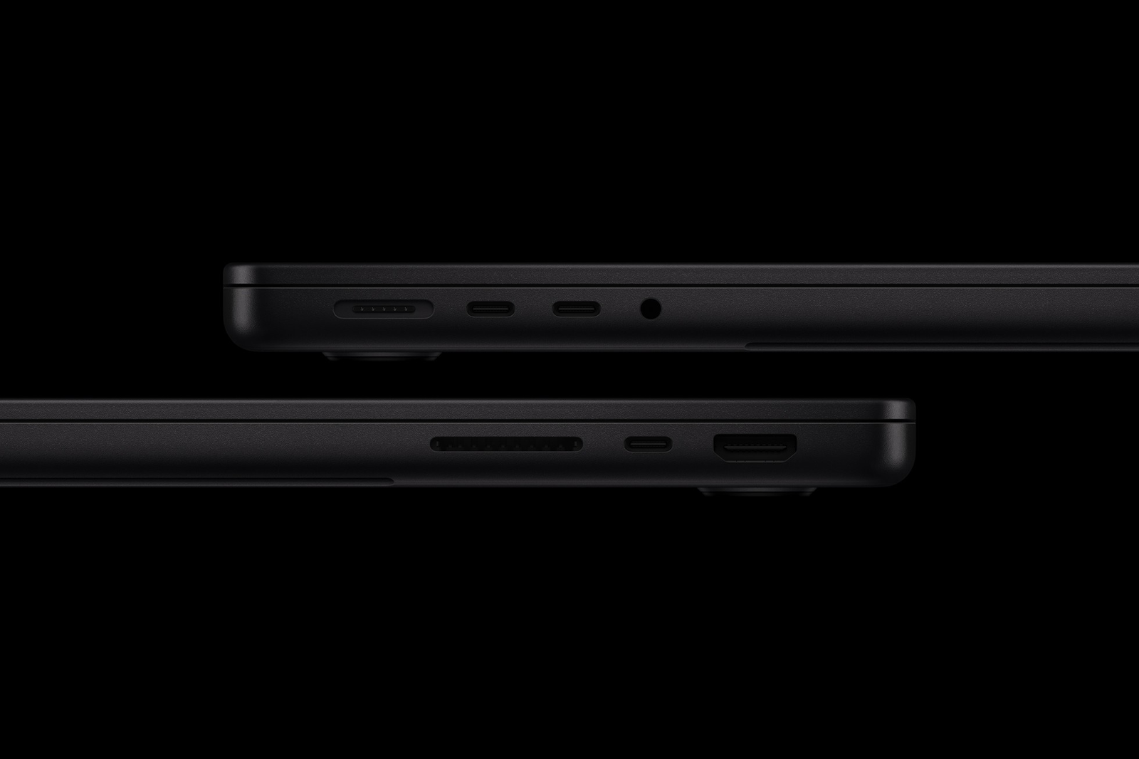 Photo: Two side views of Apple's 14-inch MacBook Pro with M6 in black, showing its ports and card slot.