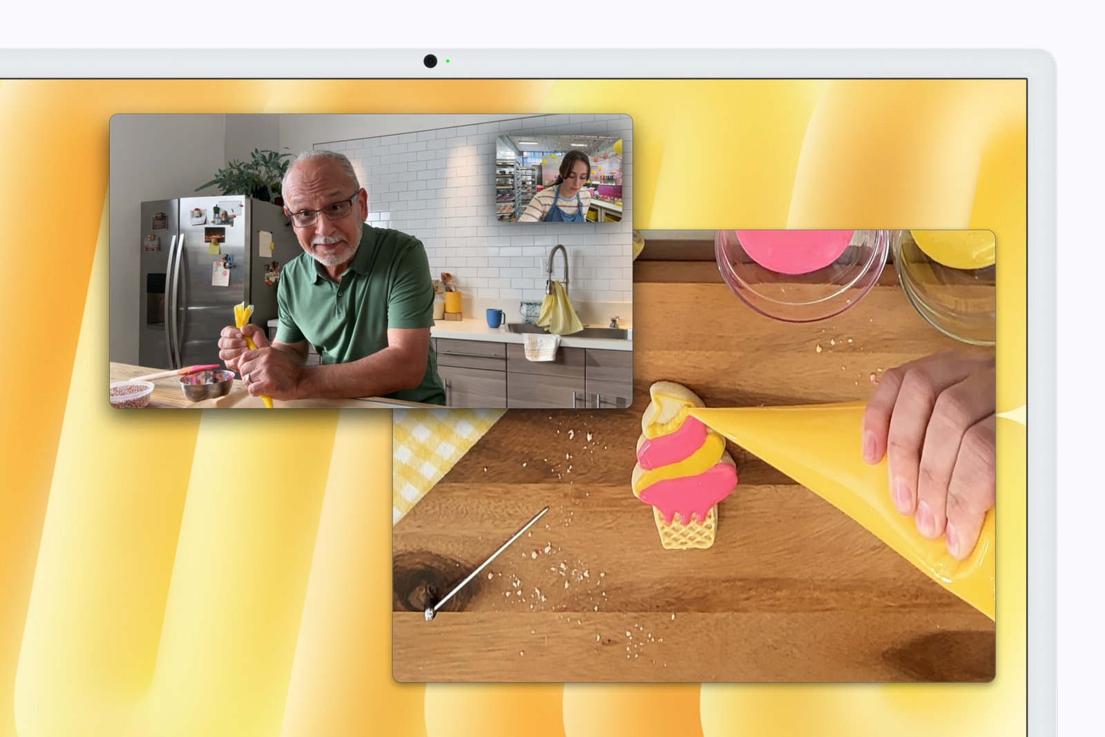 A video call on the M6 iMac using Center Stage, with Desk View showing the desk below