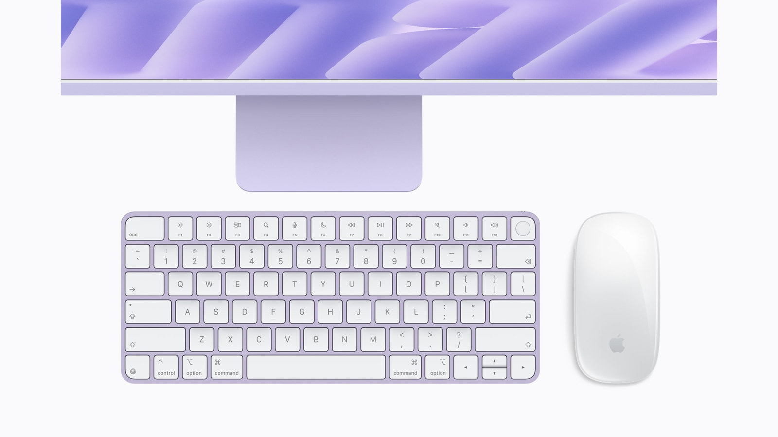 A purple M6 iMac with its color-matched keyboard and mouse