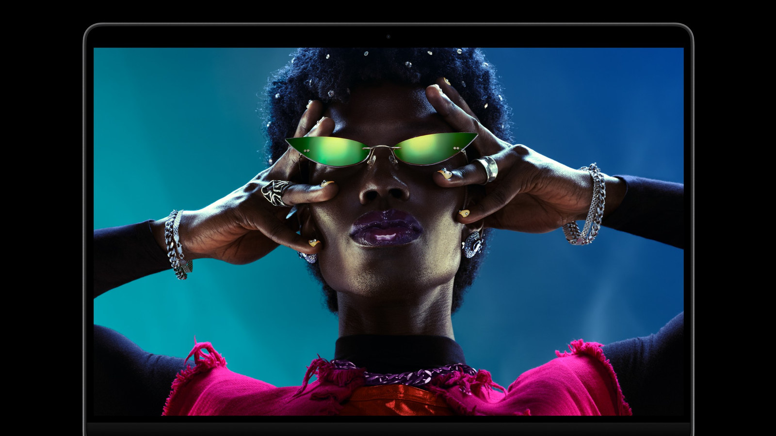 Apple's 14-inch MacBook Pro with M6, open, showing its Liquid Retina XDR display